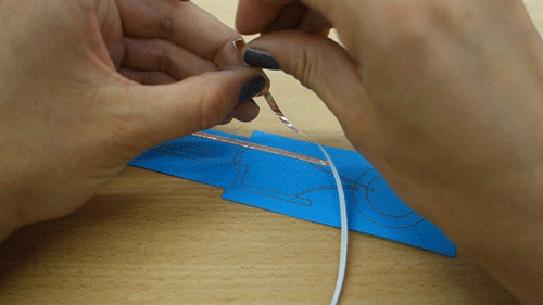 Animation of sticking down the copper tape.