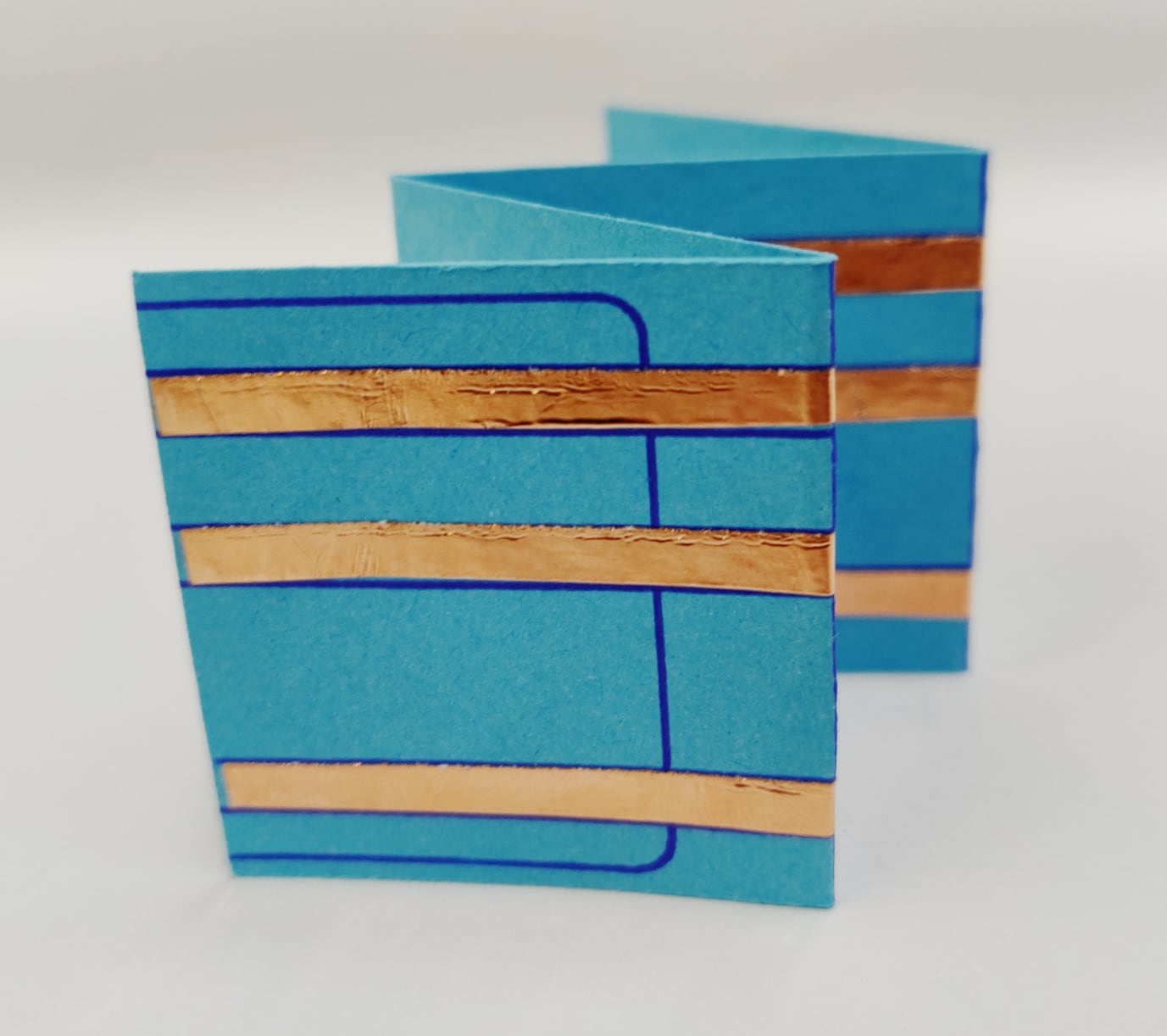 Photo of folded template in accordion shape.