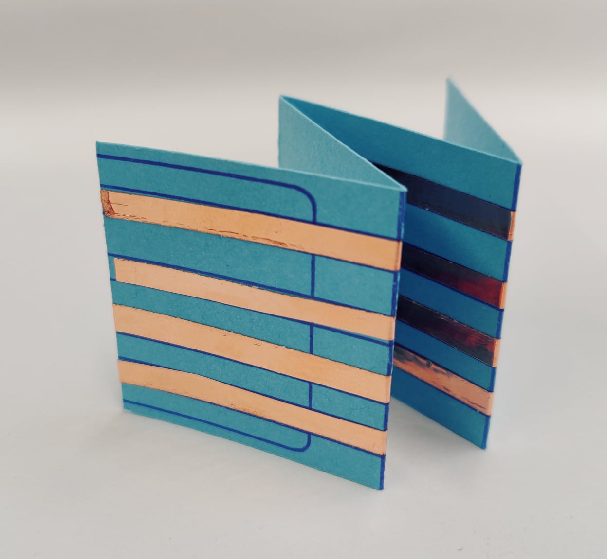 Photo of folded template in accordion shape.